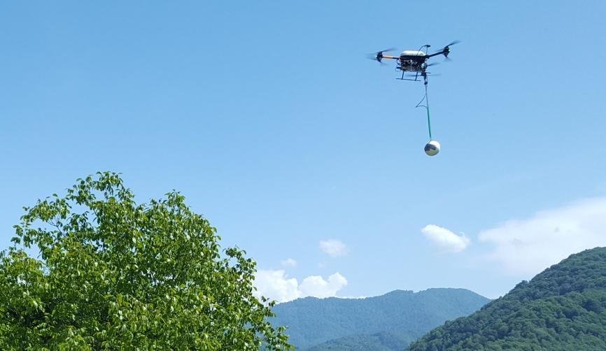 MGT single-sensor drone surveying above a landscape