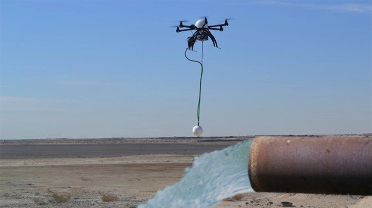 MGT illustration combining a drone carrying a suspended sensor with groundwater flowing from a pipe.